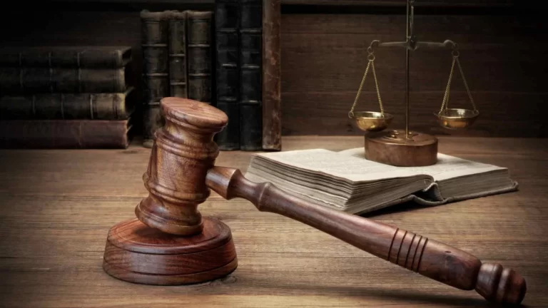 The gavel, the scales, and the books of law